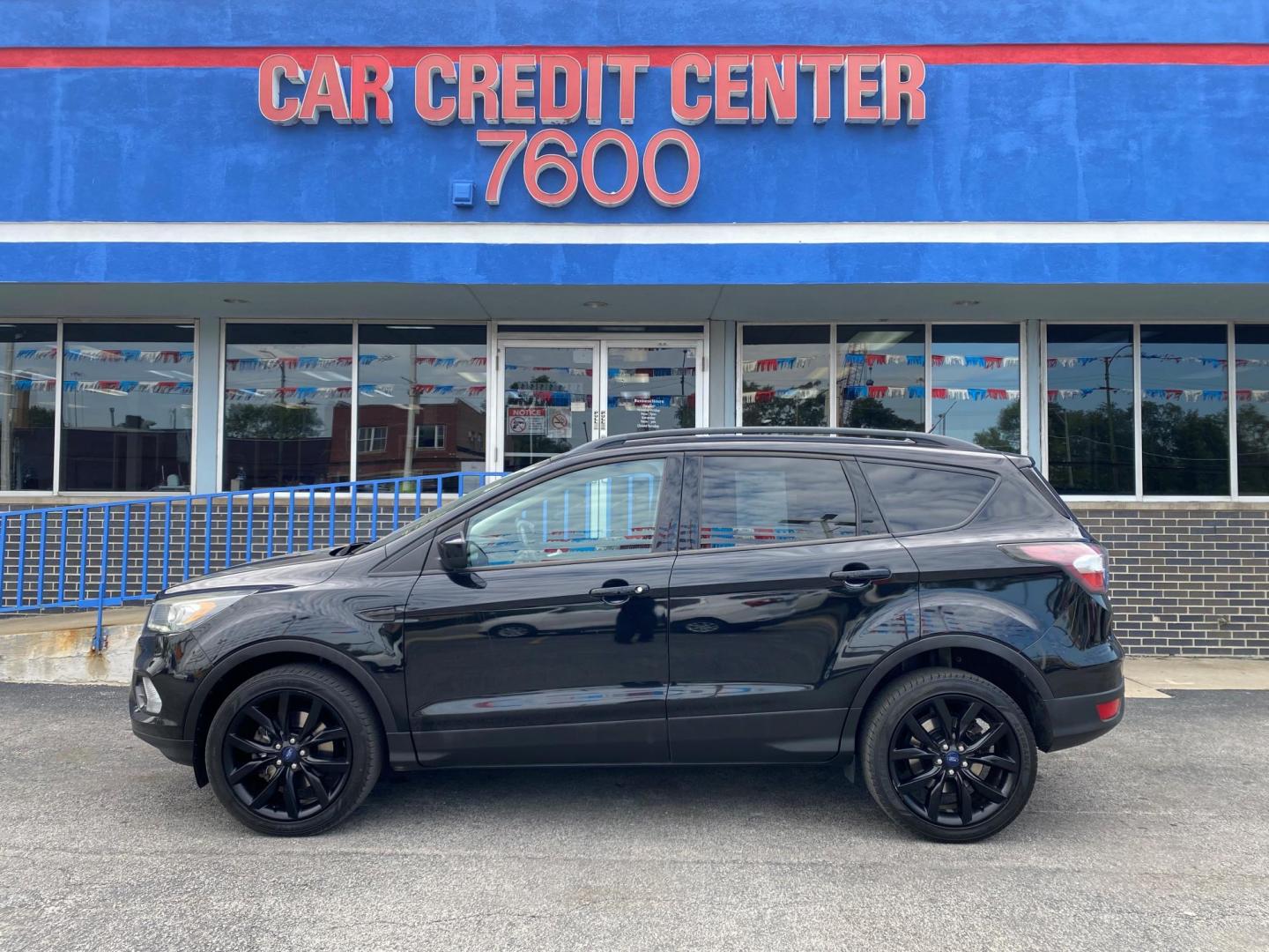 2017 BLACK Ford Escape SE 4WD (1FMCU9GD7HU) with an 1.5L L4 DOHC 16V engine, 6A transmission, located at 7600 S Western Ave., Chicago, IL, 60620, (773) 918-3980, 0.000000, 0.000000 - Photo#0