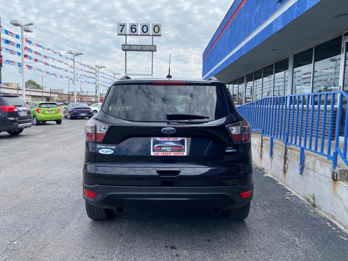 2017 BLACK Ford Escape SE 4WD (1FMCU9GD7HU) with an 1.5L L4 DOHC 16V engine, 6A transmission, located at 7600 S Western Ave., Chicago, IL, 60620, (773) 918-3980, 0.000000, 0.000000 - Photo#2