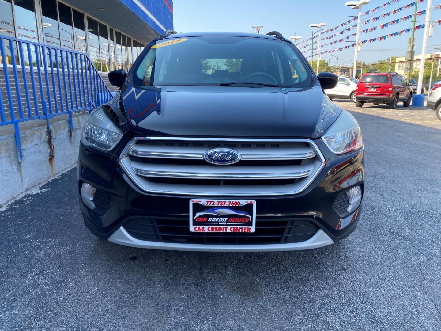 2018 BLACK Ford Escape SE FWD (1FMCU0GD2JU) with an 1.5L L4 DOHC 16V engine, 6A transmission, located at 7600 S Western Ave., Chicago, IL, 60620, (773) 918-3980, 0.000000, 0.000000 - Photo#1