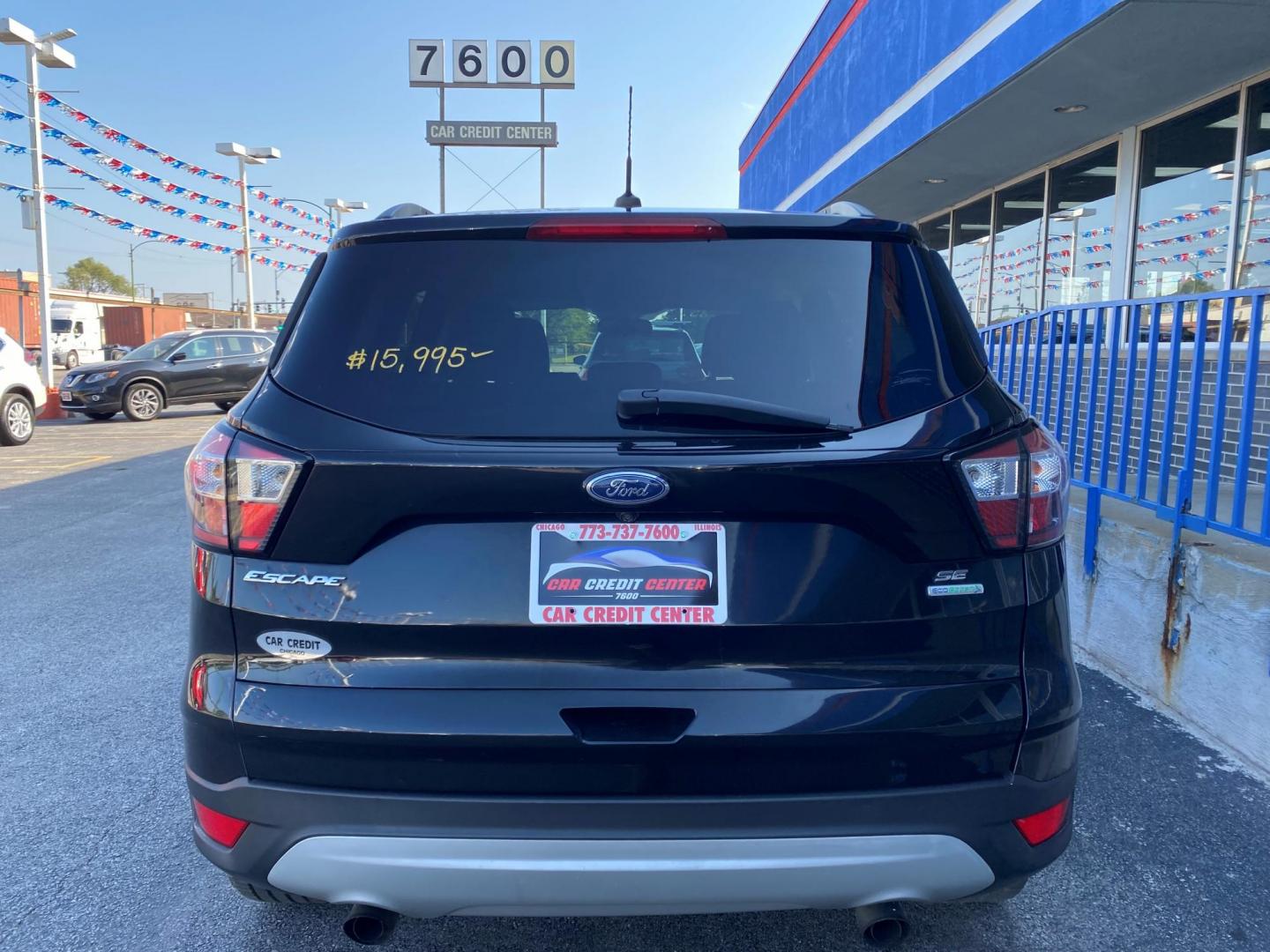 2018 BLACK Ford Escape SE FWD (1FMCU0GD2JU) with an 1.5L L4 DOHC 16V engine, 6A transmission, located at 7600 S Western Ave., Chicago, IL, 60620, (773) 918-3980, 0.000000, 0.000000 - Photo#2