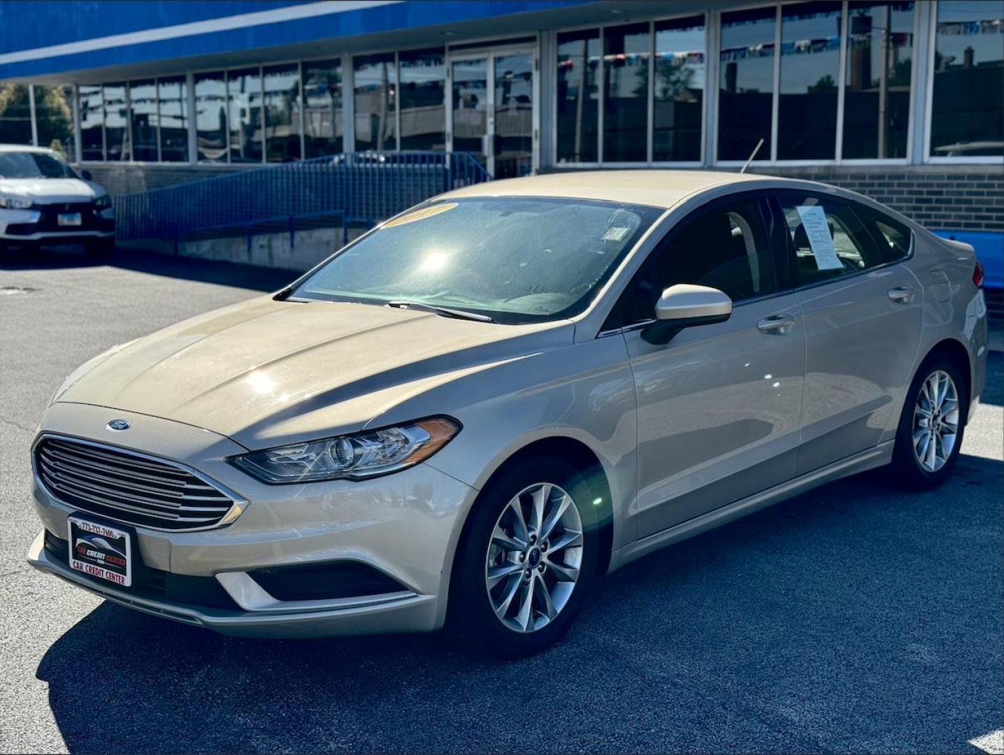 2017 GOLD Ford Fusion SE (3FA6P0HD1HR) with an 1.5L L4 DOHC 16V engine, 6A transmission, located at 7600 S Western Ave., Chicago, IL, 60620, (773) 918-3980, 0.000000, 0.000000 - Photo#1